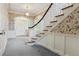 Elegant foyer featuring staircase, decorative wallpaper, and traditional chandelier at 2222 E 7Th Avenue Pkwy, Denver, CO 80206