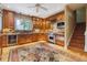 Gourmet kitchen featuring granite countertops, custom cabinets, stainless steel appliances, and natural light at 2222 E 7Th Avenue Pkwy, Denver, CO 80206