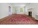 Bright living room featuring a fireplace, hardwood floors, and large windows at 2222 E 7Th Avenue Pkwy, Denver, CO 80206