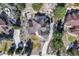 Stunning aerial view of the home showcasing the roof, landscaping, driveway, and patio at 8389 Owl Roost Ct, Parker, CO 80134