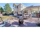 Enjoyable backyard with patio, fire pit, and seating, great for entertaining or relaxing outdoors at 8389 Owl Roost Ct, Parker, CO 80134