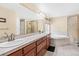 A clean bathroom with a soaking tub and glass-enclosed shower at 8389 Owl Roost Ct, Parker, CO 80134