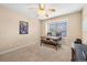 Bedroom/office showcasing a window, fan, and a desk setup with chairs at 8389 Owl Roost Ct, Parker, CO 80134