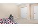 Bedroom featuring closet space and neutral paint at 8389 Owl Roost Ct, Parker, CO 80134