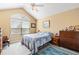 Bedroom with vaulted ceiling and window at 8389 Owl Roost Ct, Parker, CO 80134