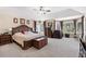 Spacious main bedroom featuring bay windows, tray ceilings, and comfortable neutral decor at 8389 Owl Roost Ct, Parker, CO 80134