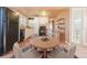 Kitchen with white cabinets, black appliances, and wood flooring at 4739 Pearl St, Denver, CO 80216