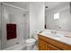 Well-lit bathroom with glass enclosed shower, modern vanity, and neutral color palette at 2165 S Nucla Way, Aurora, CO 80013