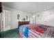 Bright bedroom features plush carpet, adjoining bath and generous closet space at 2165 S Nucla Way, Aurora, CO 80013