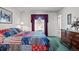 Comfortable bedroom features bright window, plush carpet, and a large decorative dresser at 2165 S Nucla Way, Aurora, CO 80013