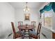 Cozy breakfast nook features a round table, cushioned chairs, and a bright window at 2165 S Nucla Way, Aurora, CO 80013
