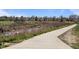 Walking trail with creek and green space within the community at 2165 S Nucla Way, Aurora, CO 80013