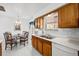 Bright kitchen features updated appliances, tile floors, and a cozy breakfast nook for casual dining at 2165 S Nucla Way, Aurora, CO 80013