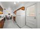 Well-lit kitchen with ample storage, modern appliances, and convenient access to the outdoor patio at 2165 S Nucla Way, Aurora, CO 80013