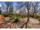 Lush, mature landscaping throughout the yard with trees and garden at 2165 S Nucla Way, Aurora, CO 80013