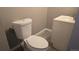 Compact bathroom featuring a toilet and vanity with a sink at 4543 Cathay St, Denver, CO 80249