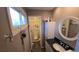 Bathroom featuring walk-in tub and black countertop at 4543 Cathay St, Denver, CO 80249