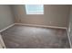 Empty bedroom with neutral carpet and a window at 4543 Cathay St, Denver, CO 80249