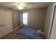 Bedroom featuring ceiling fan and window at 4543 Cathay St, Denver, CO 80249