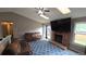 Living room featuring a fireplace, skylights, and comfortable seating, with a view of the backyard at 4543 Cathay St, Denver, CO 80249