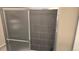 Walk-in shower features gray tiles and sliding door at 4543 Cathay St, Denver, CO 80249