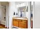 Clean bathroom with a vanity, mirror, and shower/tub combo at 8865 Federal Blvd # 202, Westminster, CO 80260