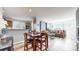 Bright dining area with a table, chairs, and kitchen views at 8865 Federal Blvd # 202, Westminster, CO 80260