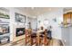 Dining area with a table and chairs next to a fireplace at 8865 Federal Blvd # 202, Westminster, CO 80260