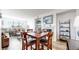Bright dining area with four chairs and a view into the living room at 8865 Federal Blvd # 202, Westminster, CO 80260
