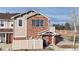 Two-story brick townhouse with a private entrance and attached garage at 8865 Federal Blvd # 202, Westminster, CO 80260