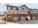 Brick townhouse exterior with attached garage and balcony at 8865 Federal Blvd # 202, Westminster, CO 80260