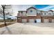 Townhouse exterior showcasing a brick facade and attached garage at 8865 Federal Blvd # 202, Westminster, CO 80260