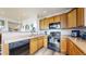 Well-lit kitchen with ample counter space and modern appliances at 8865 Federal Blvd # 202, Westminster, CO 80260