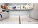 Laundry room with washer, dryer, and shelving for storage at 8865 Federal Blvd # 202, Westminster, CO 80260