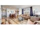 Spacious living room featuring a comfortable seating area and hardwood floors at 8865 Federal Blvd # 202, Westminster, CO 80260