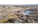 Aerial view of a park with walking paths and a pond at 8865 Federal Blvd # 202, Westminster, CO 80260
