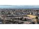 Aerial view of elementary school with playground, near mountains at 8865 Federal Blvd # 202, Westminster, CO 80260
