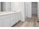 Bathroom features double sinks, sleek cabinetry, and a glass-enclosed shower at 45916 Gentry Ave, Bennett, CO 80102
