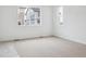 Bright bedroom features carpet and large windows that offer natural light and views at 45916 Gentry Ave, Bennett, CO 80102