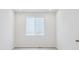 Bright room with modern flooring, natural light from a large window, and crisp white walls at 45916 Gentry Ave, Bennett, CO 80102
