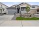 Charming single-Gathering home with a well-manicured lawn, inviting curb appeal and a covered front porch at 45916 Gentry Ave, Bennett, CO 80102