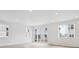 Bright living room with ample natural light, featuring sleek flooring and modern finishes for a clean and airy aesthetic at 45916 Gentry Ave, Bennett, CO 80102