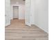 Open floor plan featuring modern flooring, with the doors letting in natural light for a bright and airy feel at 45916 Gentry Ave, Bennett, CO 80102