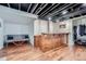 Basement area with bar area, seating, and wood floor at 2286 S Pitkin Way # A, Aurora, CO 80013