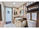 Bathroom with updated vanity, open shelf, and light fixtures at 2286 S Pitkin Way # A, Aurora, CO 80013