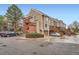 Multi-level townhome featuring wood and brick accents, with private decks and assigned parking spaces at 2286 S Pitkin Way # A, Aurora, CO 80013