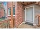 Inviting brick entryway with a painted door and a welcoming doormat at 2286 S Pitkin Way # A, Aurora, CO 80013