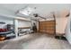 View of garage featuring tools, work bench and garage door at 2286 S Pitkin Way # A, Aurora, CO 80013