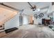 Clean garage with stairs, a utility sink, storage, and bicycles at 2286 S Pitkin Way # A, Aurora, CO 80013