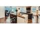 Bright kitchen with wood countertops, white cabinets, and a stainless steel farmhouse sink at 2286 S Pitkin Way # A, Aurora, CO 80013
